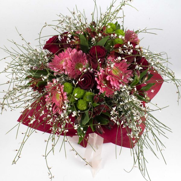 Bouquet of roses, green chrysanthemum, gerbera, alstroemeria and achenes