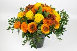 Flower arrangement with roses, mini gerbera, calendula and rose hips